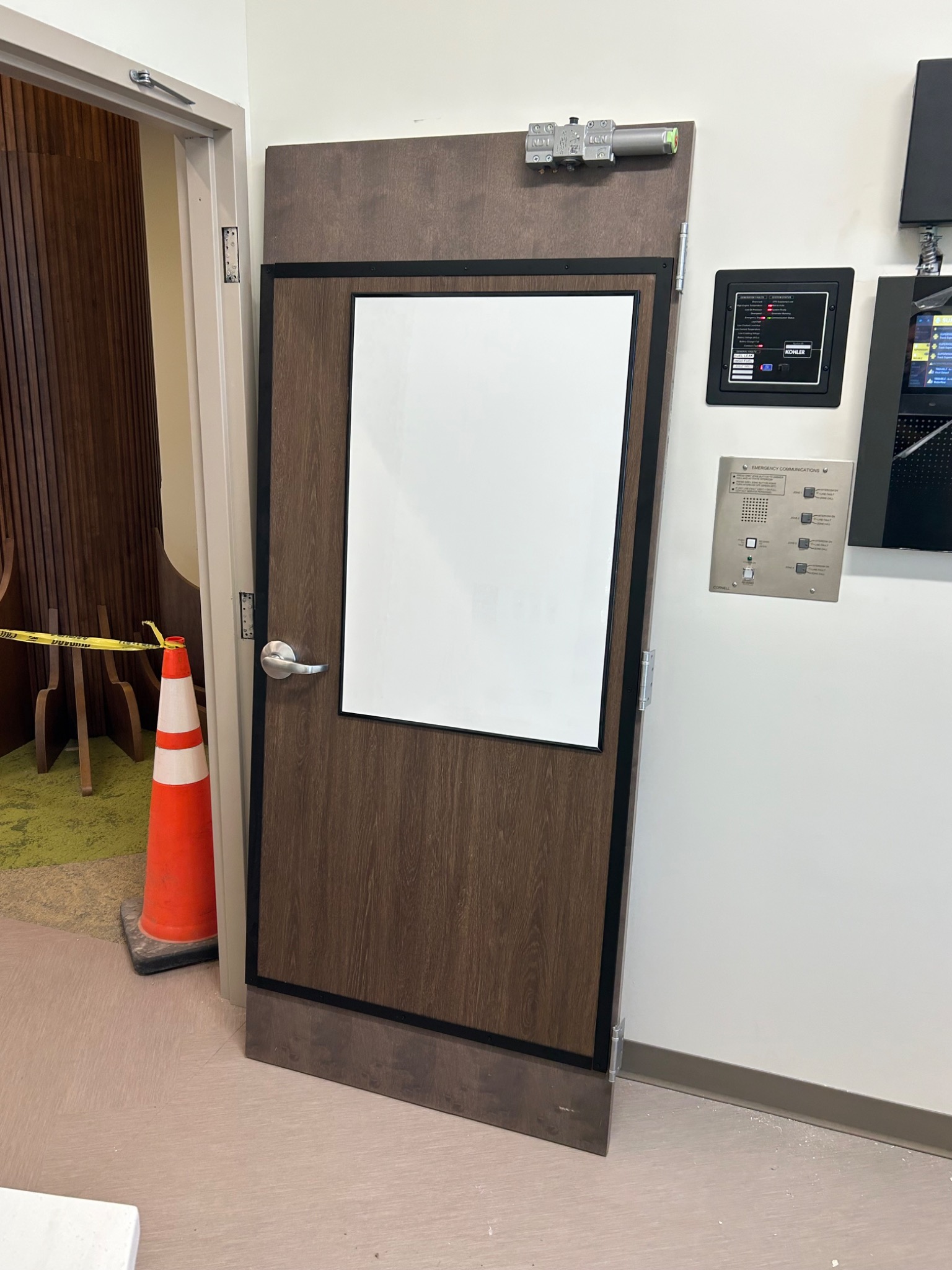 Door Sentry retrofit system installed on an existing door